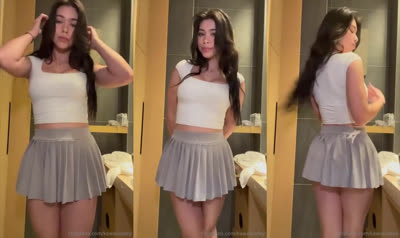 Aishah Sofey Looks In The Mirror Before Playing Tennis