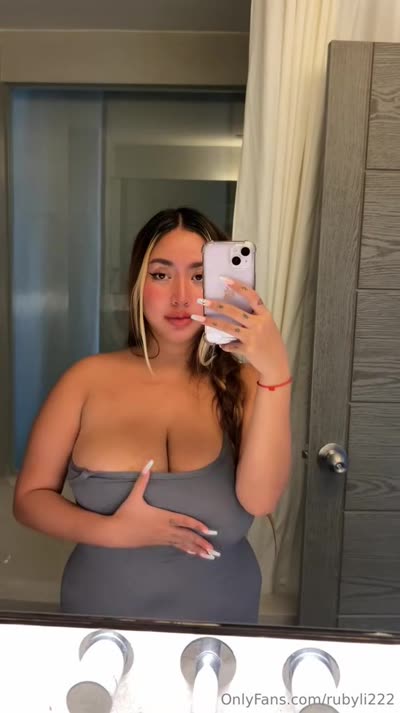 Ruby Li Puts On A Low Cut Dress